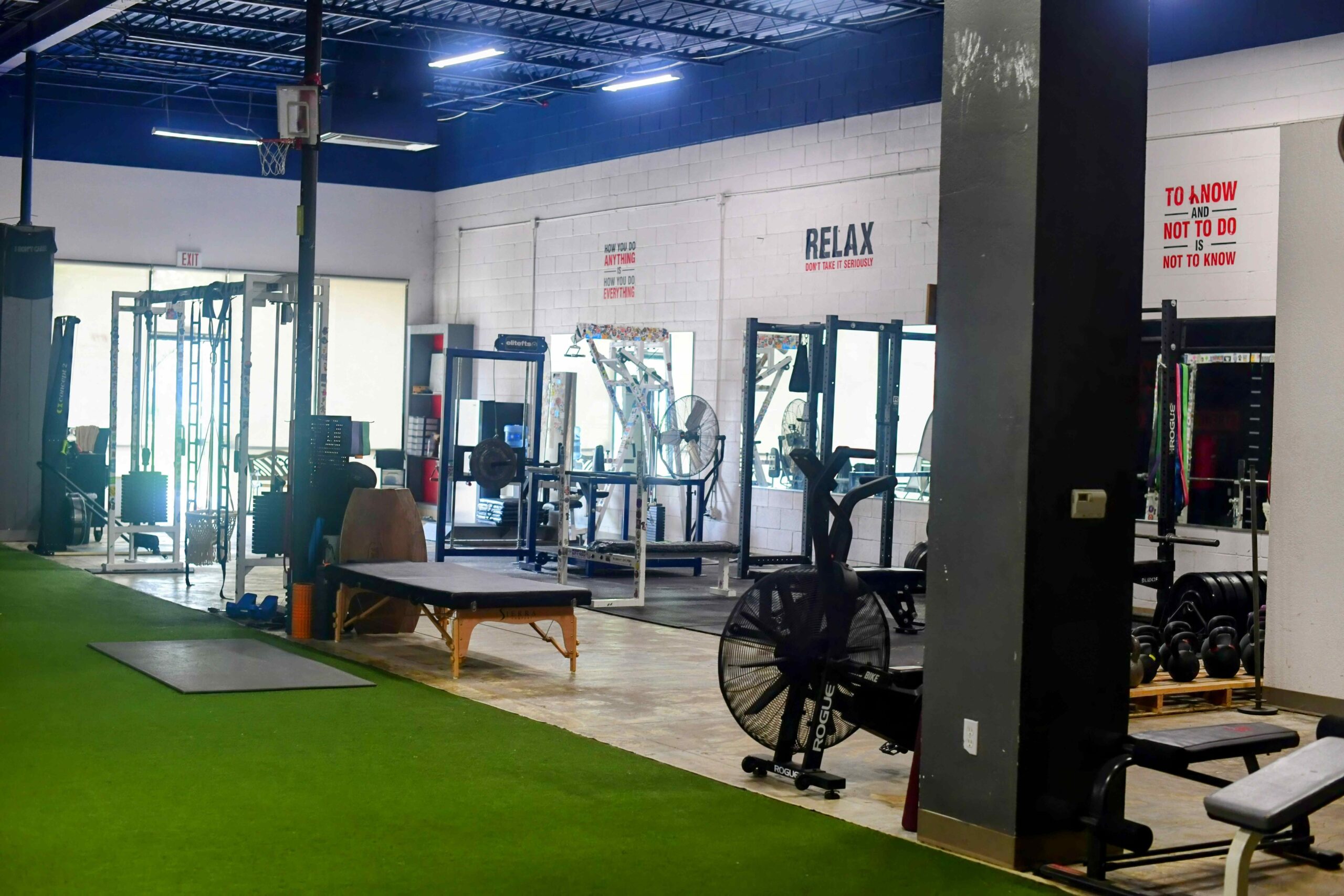 A spacious and clean workout area showcasing state-of-the-art fitness equipment and facilities